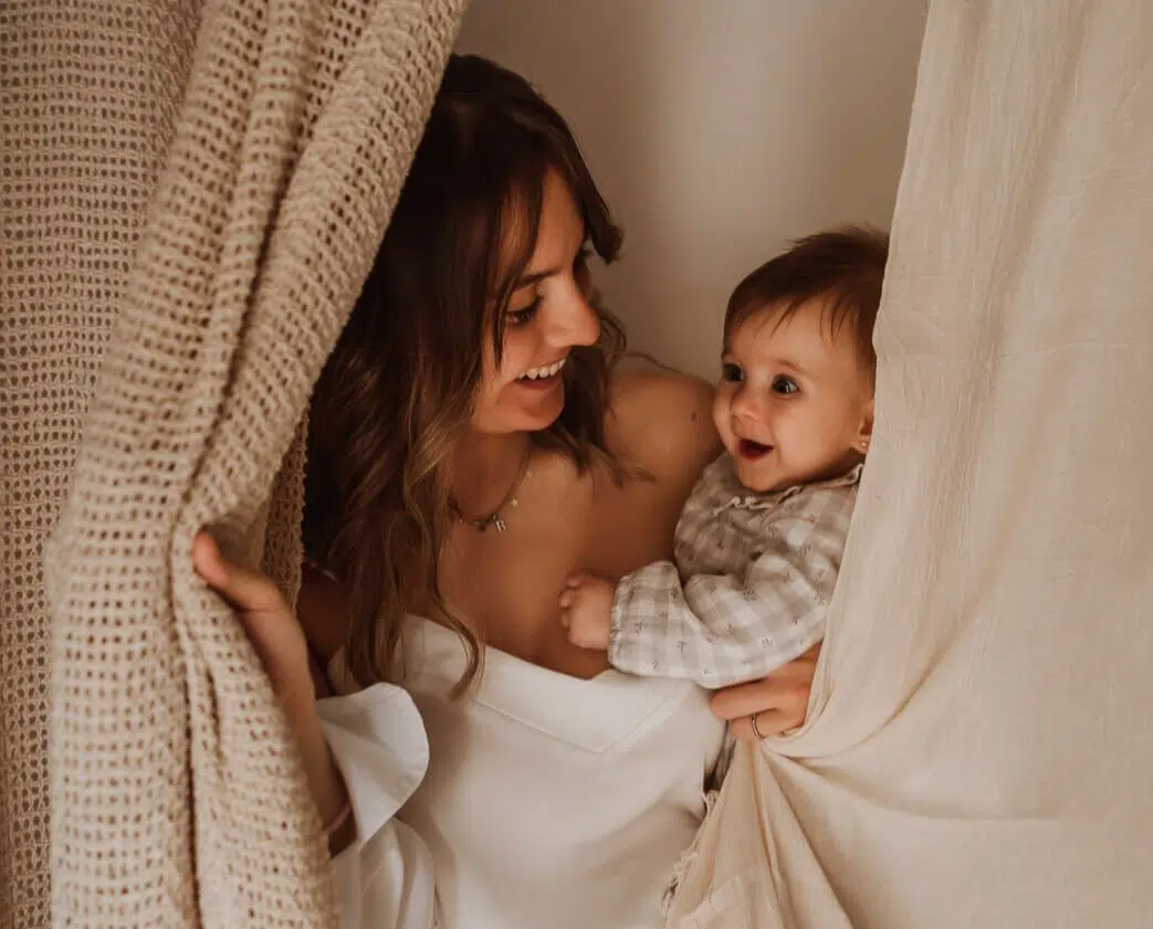 Mother and baby enjoying a cozy photo session.