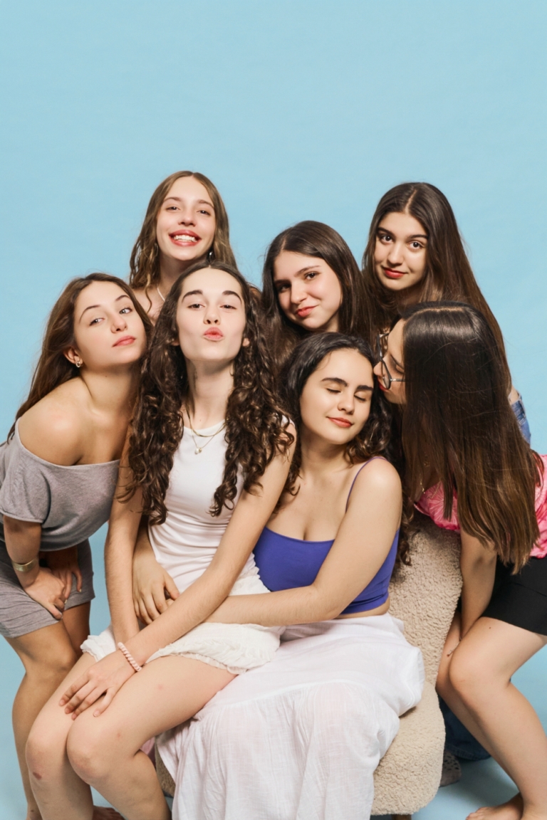 group of friends laughing at a self photo studio