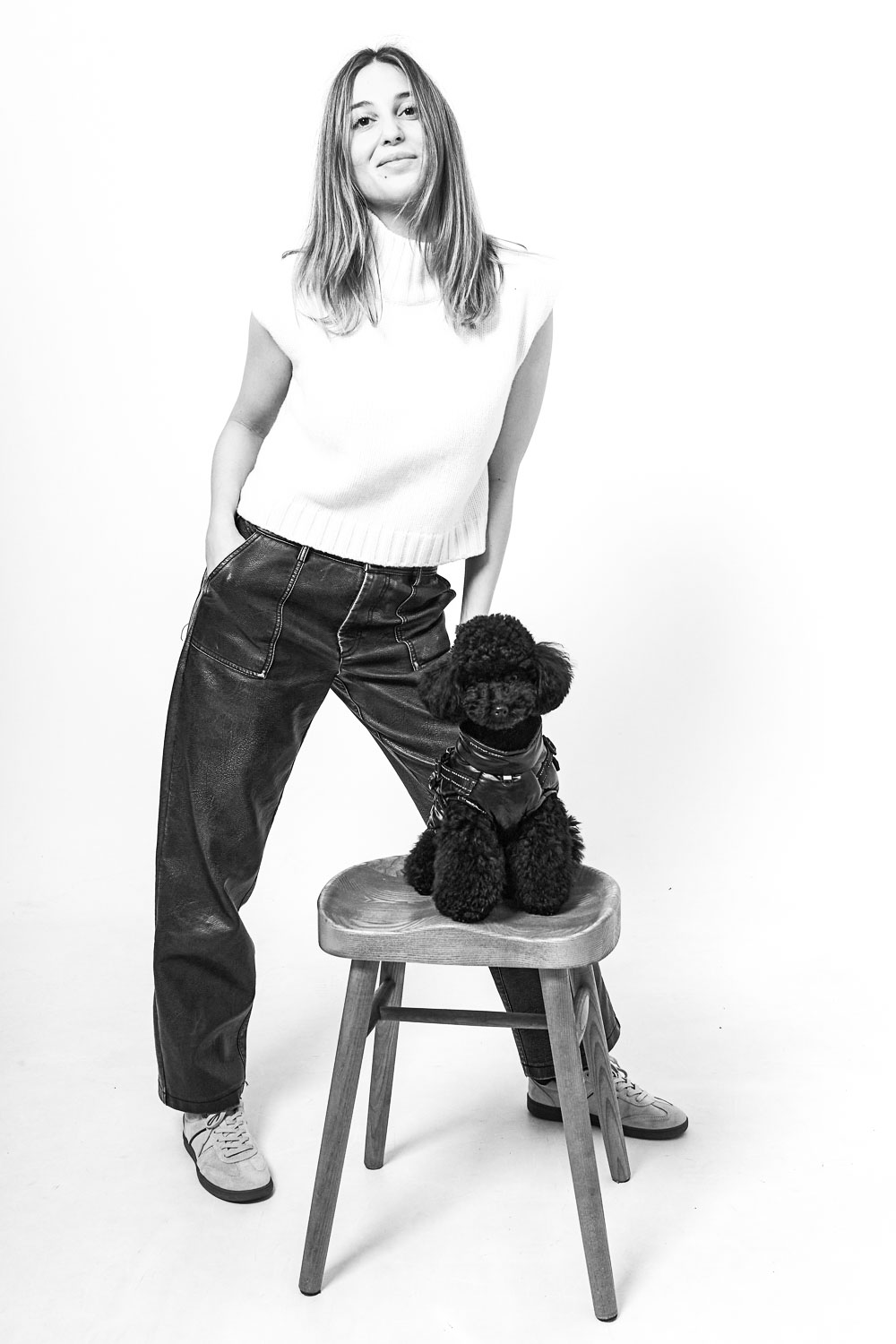woman with poodle posing for christmas session studio