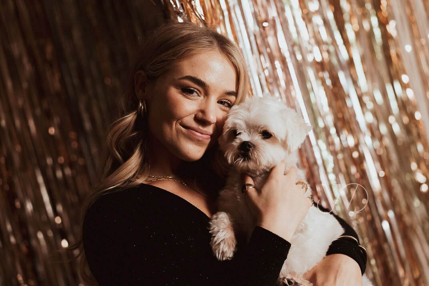 woman with christmas makeup and dog in studio
