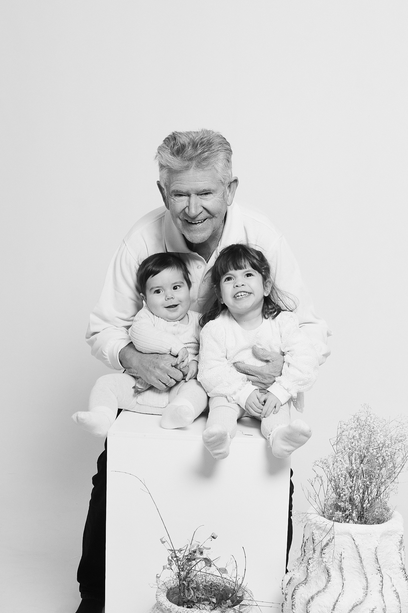 grandfather grandchildren black white tender family photos