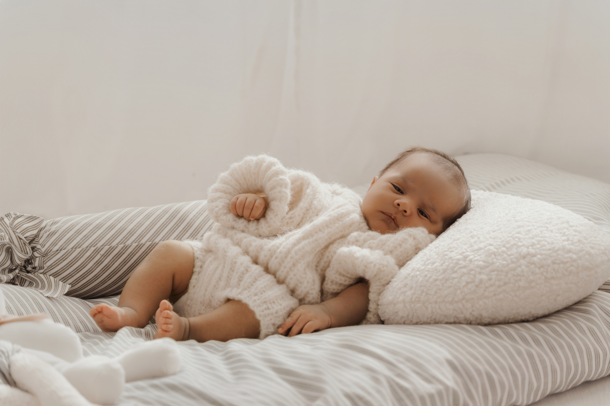 sleeping baby cushion newborn photos at home