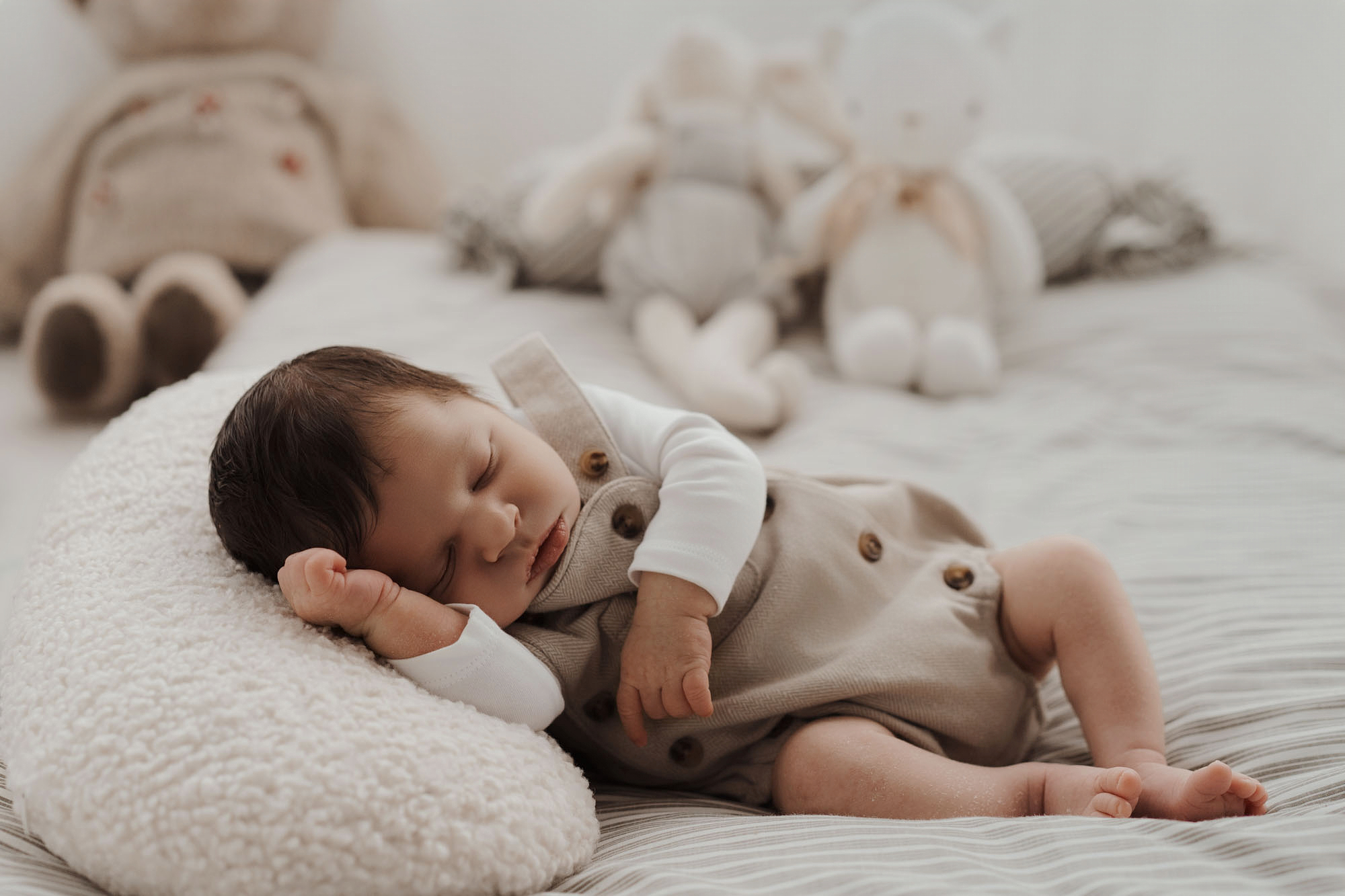 baby sleeping stuffed animal newborn photos home neutral