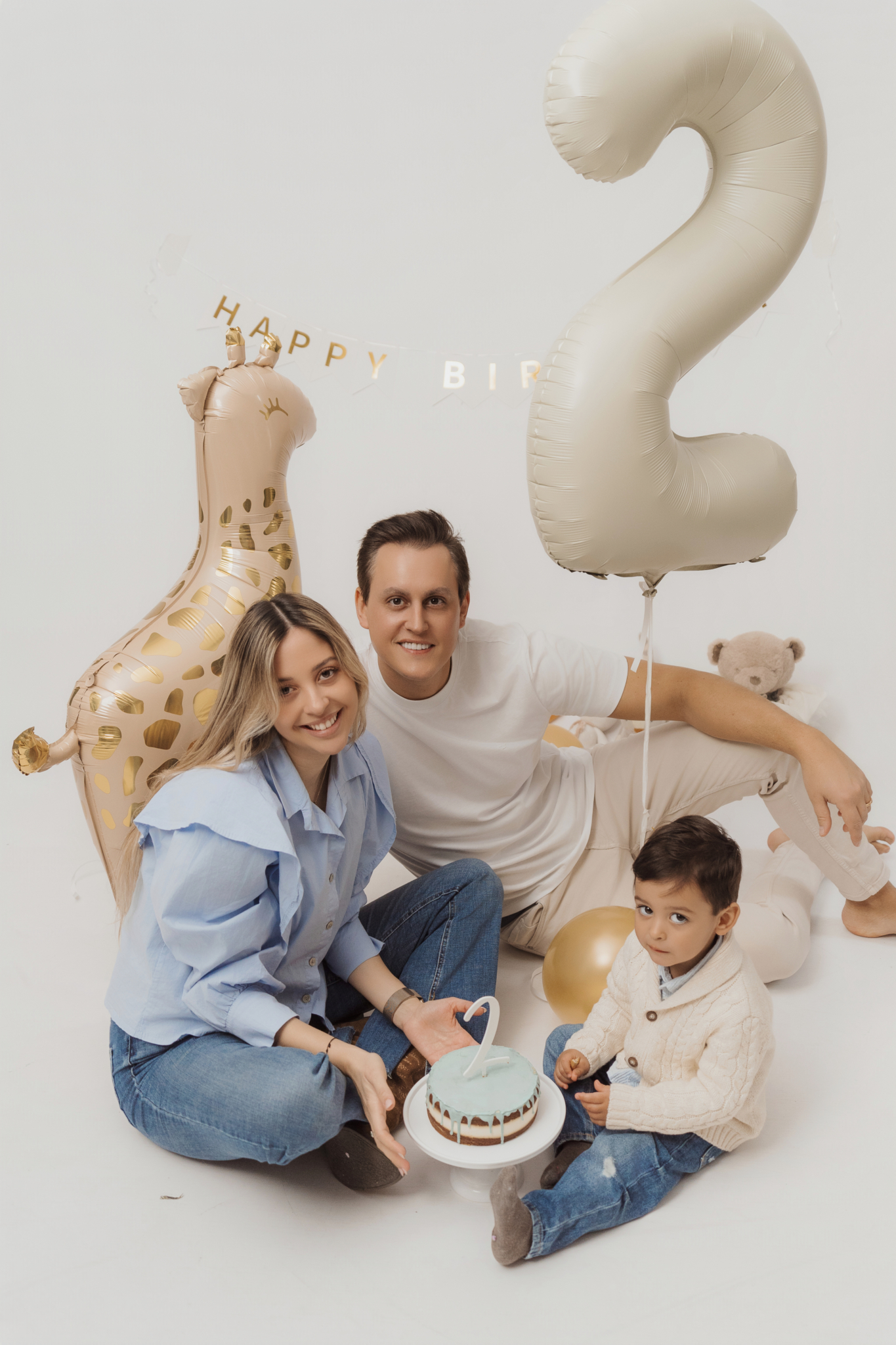 family celebrating second birthday balloons number original studio family photos