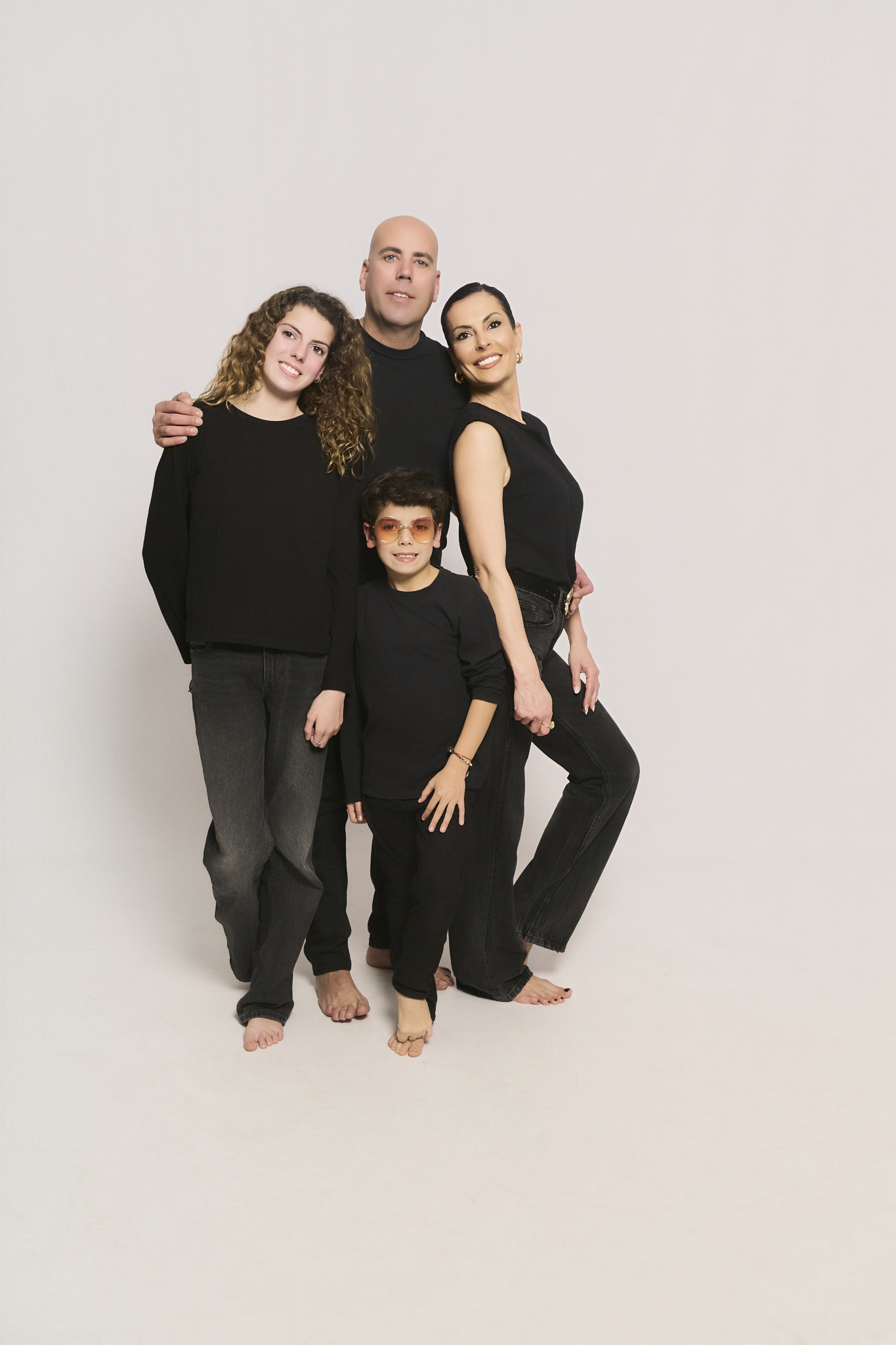 family of four coordinated black teen family photos