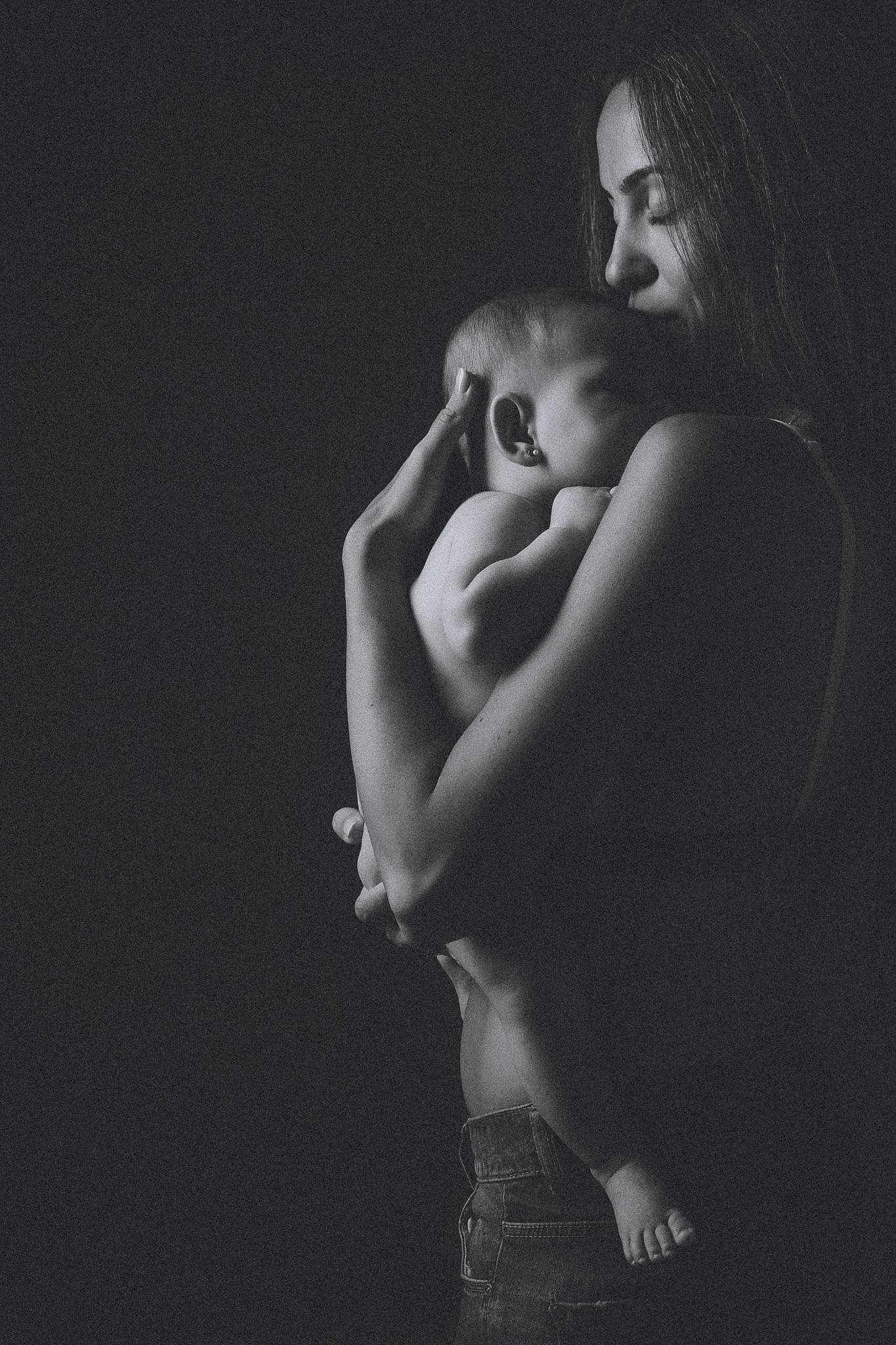 mom newborn tender embrace dark original studio family photos