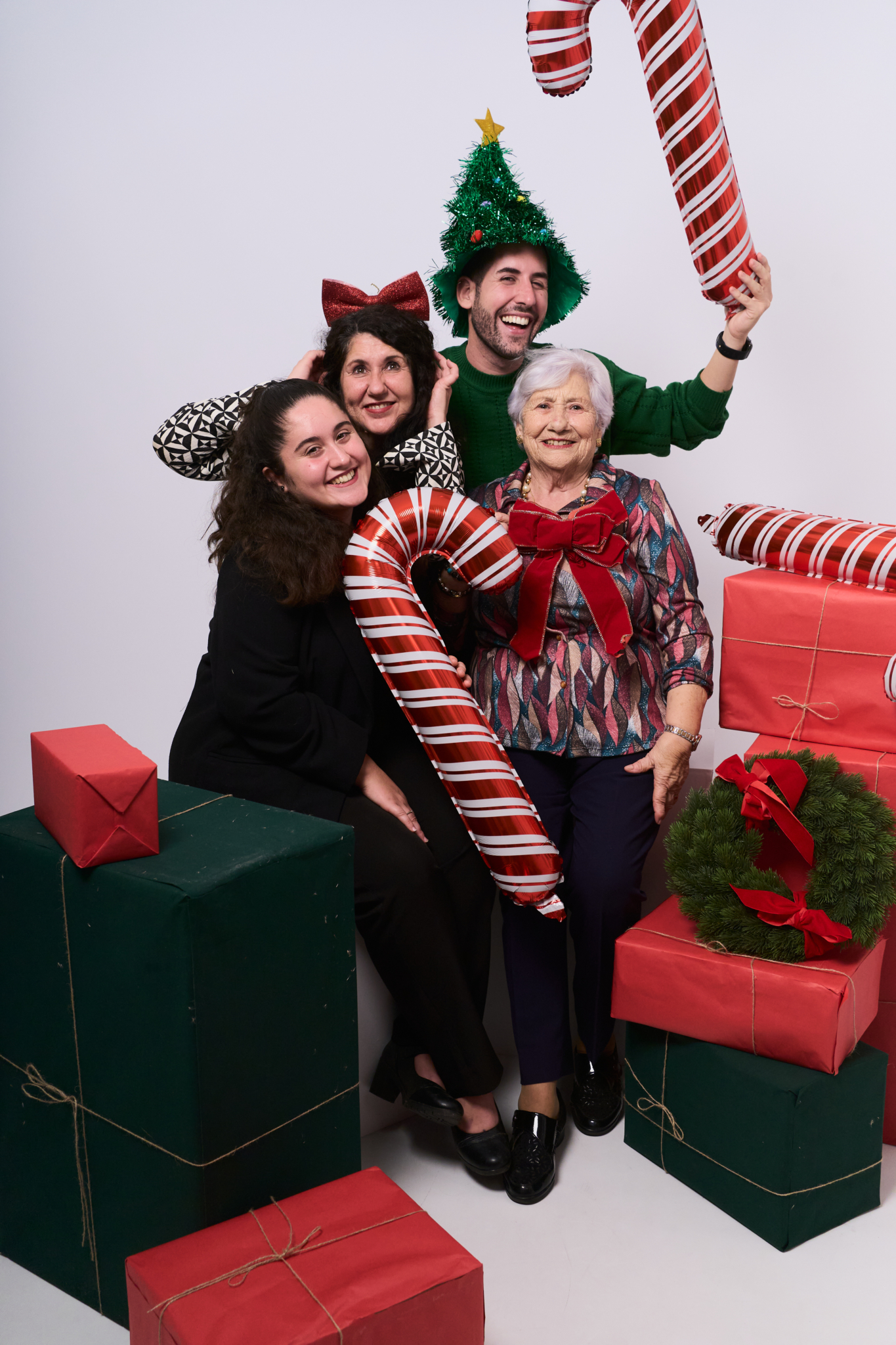 multigenerational christmas family photos candy canes gifts