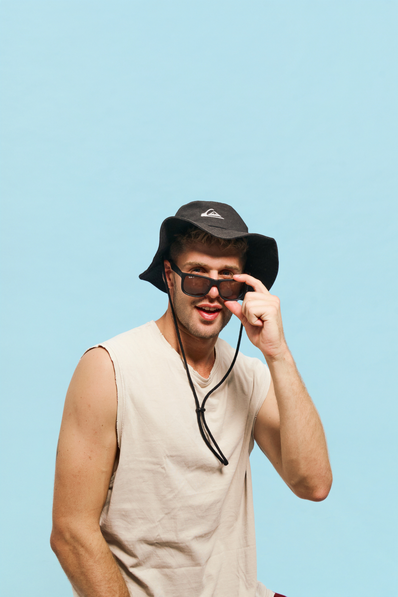 casual portrait sunglasses bright blue background family studio photo ideas