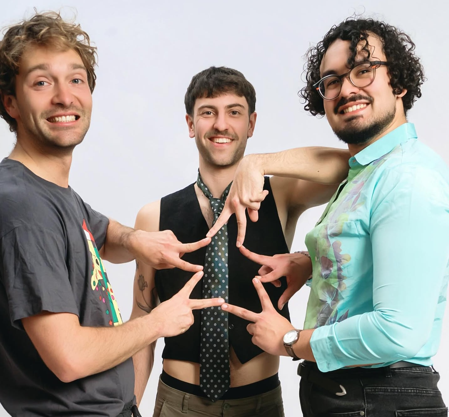 A group of friends forming a star with their hands, the final keepsake from their original stag do in Barcelona