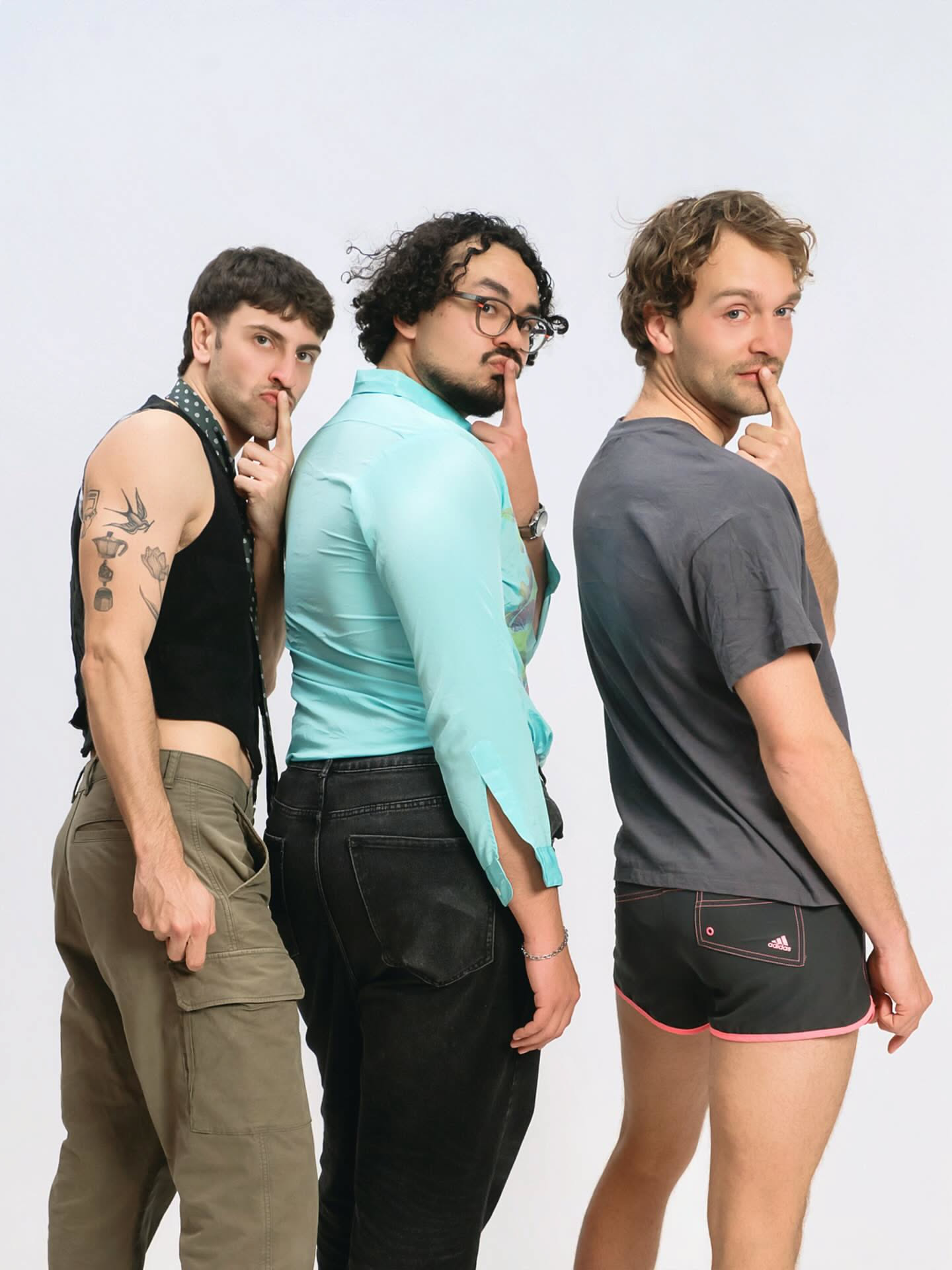 Three friends posing together at their stag-do self-photo session at YOULO